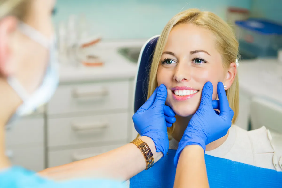 Happy smiling patient after dental exam